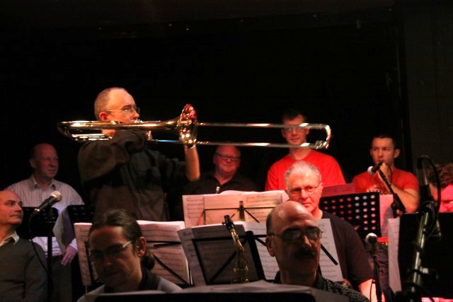 Mark Bassey plays over the band